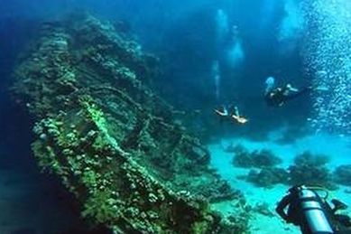 Reef with a sandy bottom from a side and rocks ( Corals Pinnacles ...